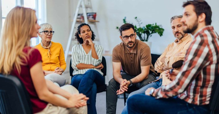 What Types of Addiction Do Rehab Centres in Cape Town Treat? 4 Support group sitting in a circle discussing recovery, representing the range of addictions treated at rehab centres in Cape Town